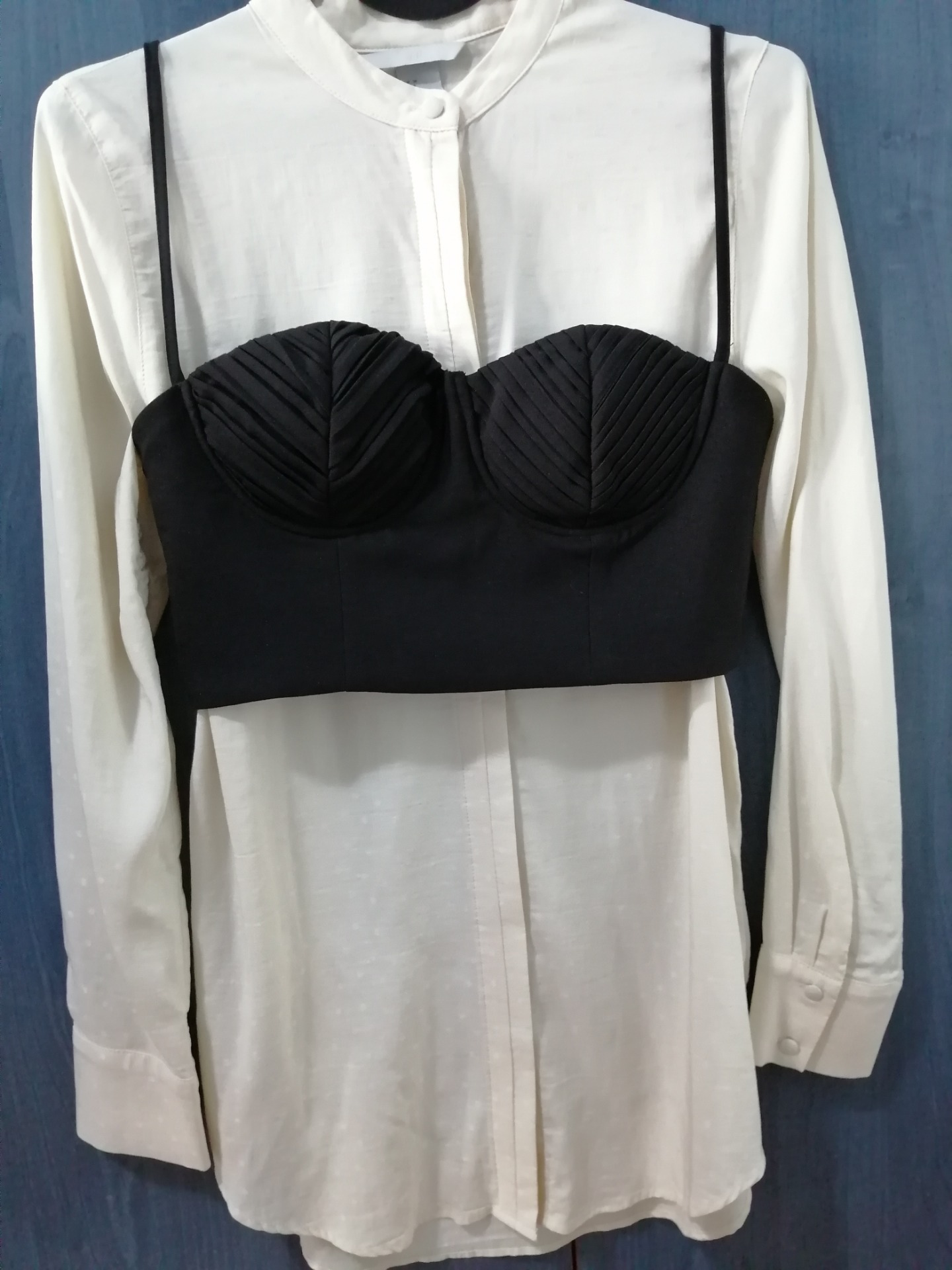 A white shirt with a black corset top